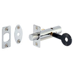 A chrome-finished metal latch lockset with a cylindrical bolt, two mounting plates, and a black key, shown on a plain white background.