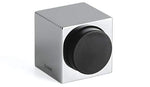 Silver cube-shaped object with a black circular component on a white background