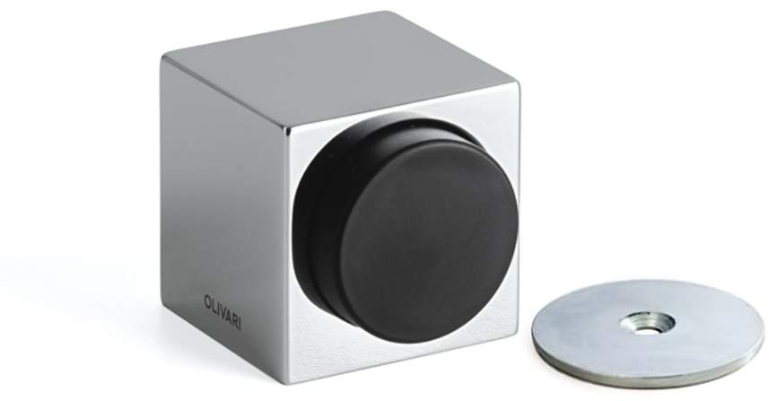 Metallic cube with a black circular component and a smaller metallic disc on a white background