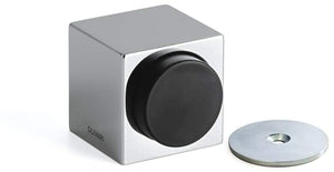 Metallic cube with a black circular component and a smaller metallic disc on a white background