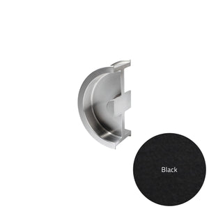 Metallic door handle and black circular sample on a white background