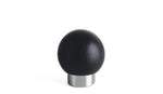 Black spherical knob on a white background