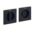 Two black square wall plates with a central circular component on a white background.