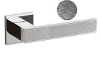 Chrome towel bar with textured detail on a white background