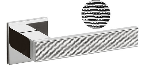 Chrome towel bar with textured detail on a white background