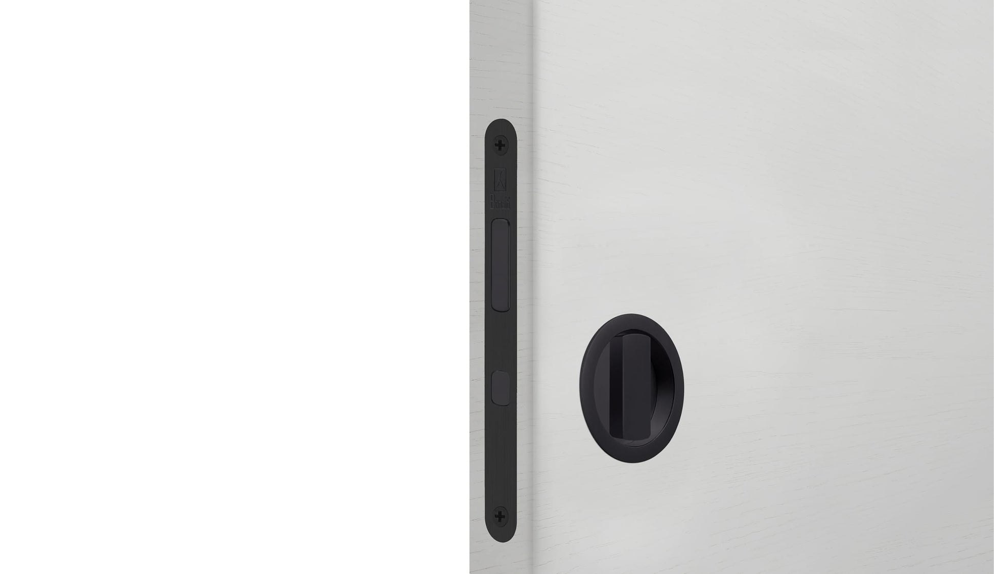 Close-up of a white cabinet with a black handle on a white background