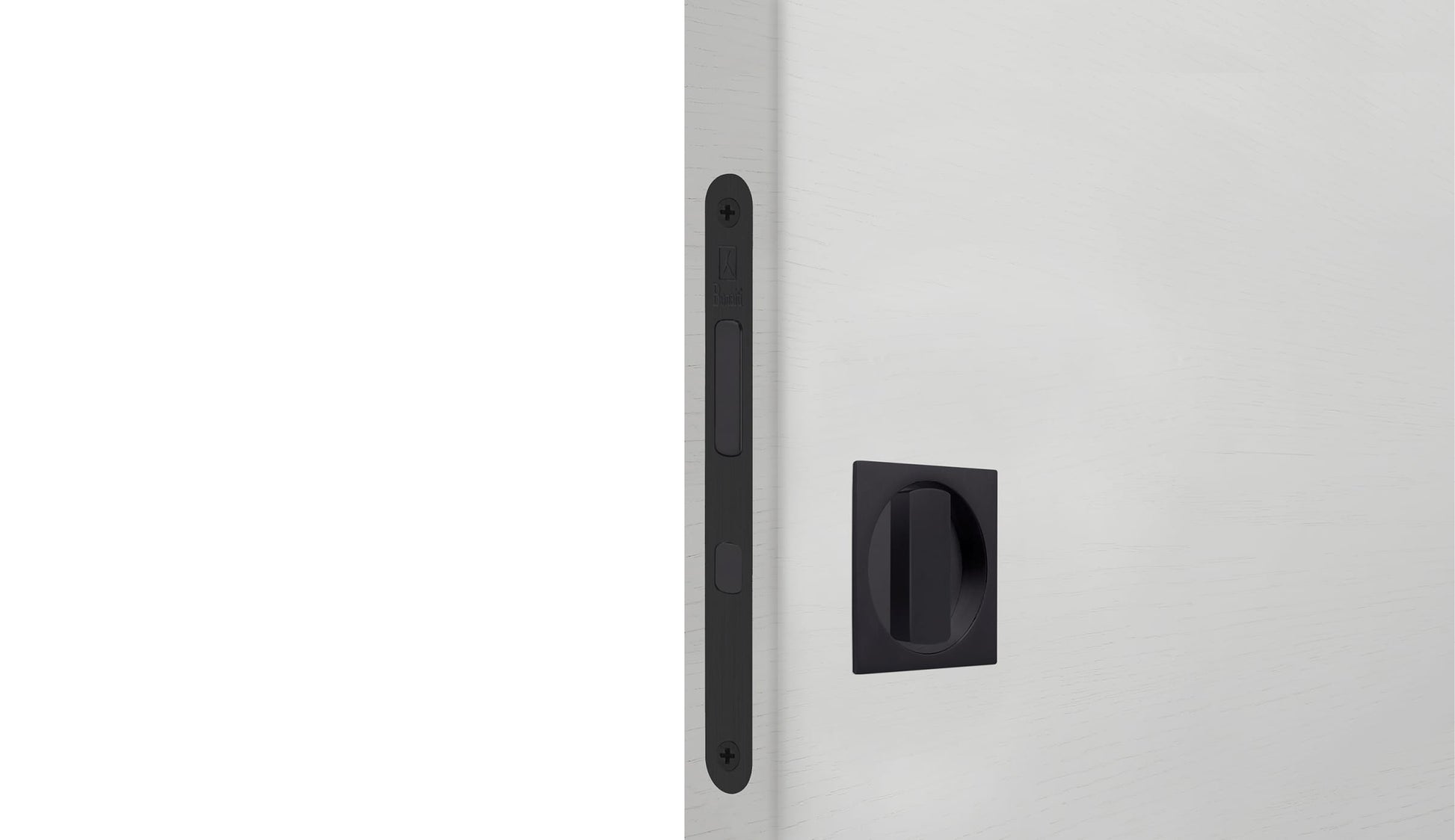 Close-up of a white door with a black handle on a light gray background