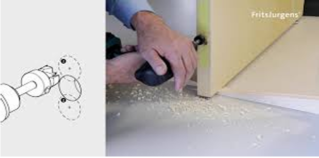 Person using a tool to work on a wooden surface with a diagram on the left.
