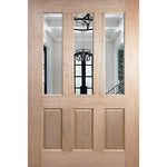 Wooden door with glass panels showing a staircase interior.