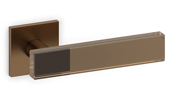 Bronze door handle with rectangular design on a white background
