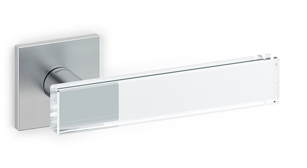 Chrome door handle with glass insert on a white background