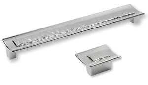 Chrome cabinet handle and pull on a white background