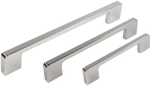 Set of four chrome cabinet handles on a white background