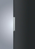 Close-up of a refrigerator door handle on a black and silver refrigerator.