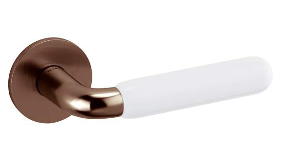 Bronze door handle with white handle on a white background