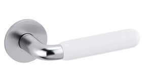 Chrome door handle with white handle on a white background