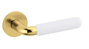 Gold door handle with white handle on a white background