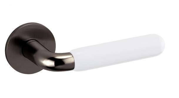 Door handle with white handle and metallic rose on a white background