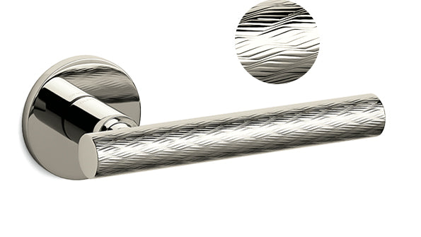 Metallic door handle with detailed texture on a white background