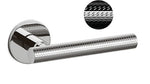 Chrome door handle with textured design on a white background