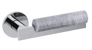Chrome toilet paper holder with a gray roll on a white background