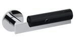 Chrome door handle with black cylindrical component on a white background