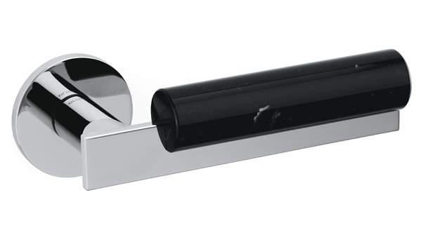 Chrome door handle with black cylindrical component on a white background