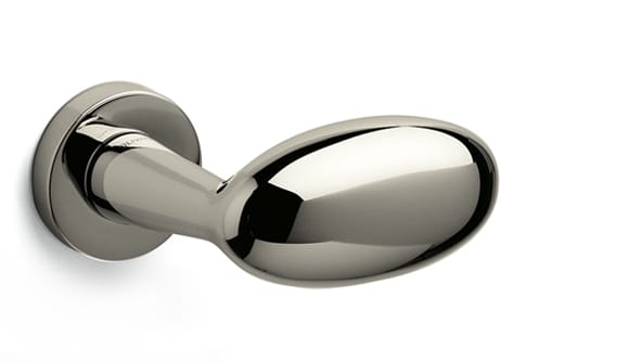 Polished chrome door handle on a white background