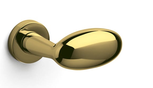 Gold door handle on a white background
