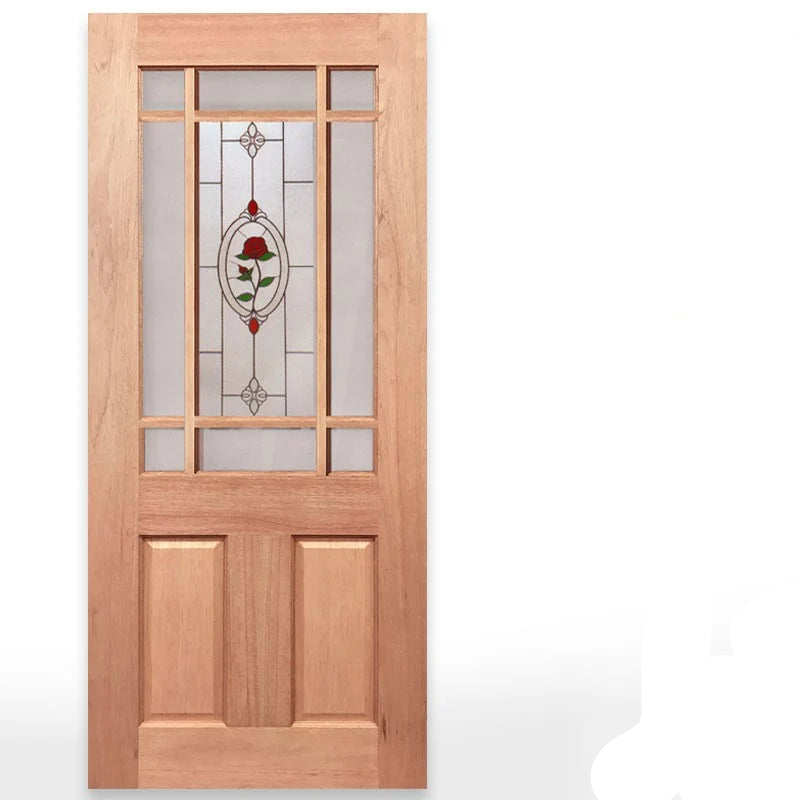 A tall wooden Calais door with a natural light brown wood finish, featuring a multi-paneled glass insert with a central jewel frost panel containing a red rose design. Text on the right identifies the door type and glass options, with the Crown Doors logo at the bottom right.