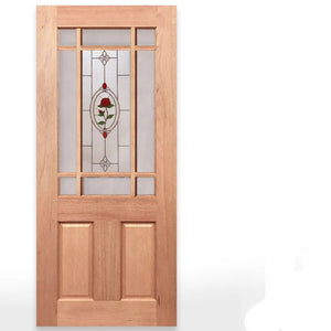 A tall wooden Calais door with a natural light brown wood finish, featuring a multi-paneled glass insert with a central jewel frost panel containing a red rose design. Text on the right identifies the door type and glass options, with the Crown Doors logo at the bottom right.