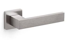 Metallic door handle on a white background