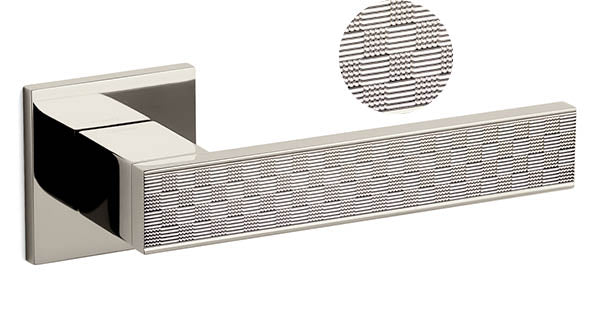 Metallic handle with textured detail on a white background