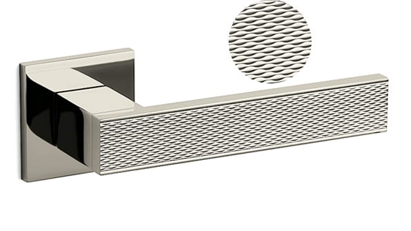 Metallic door handle with textured design on a white background