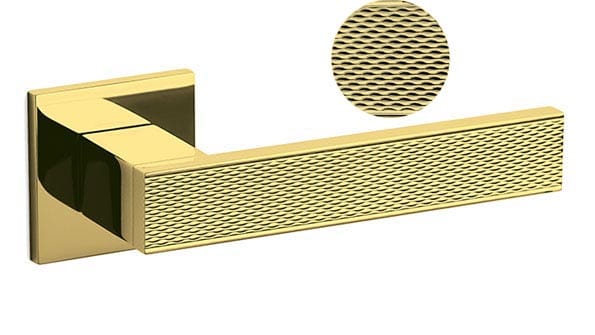 Gold textured handle with close-up detail on a white background