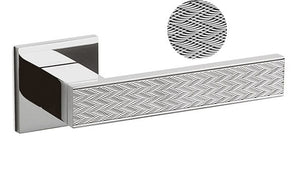 Chrome towel bar with textured end cap on a white background