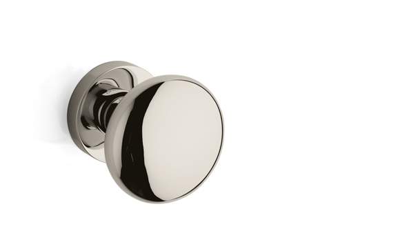 Polished chrome door handle on a white background