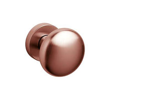Rose gold door handle on a white background