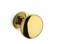 Gold door handle on a white background