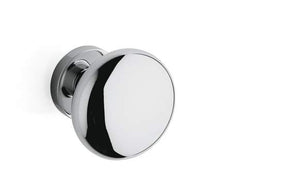 Polished chrome door knob on a white background