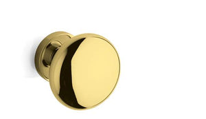 Gold door handle on a white background