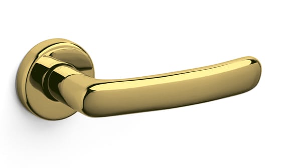 Gold door handle on a white background
