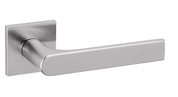 Stainless steel door handle on a white background