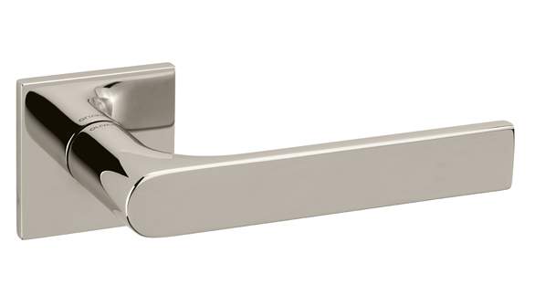 Polished metal door handle on a white background