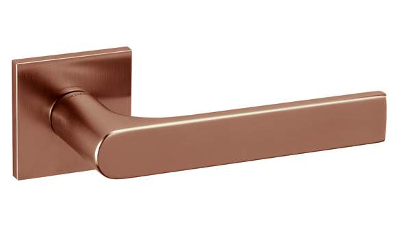 Copper door handle on a white background