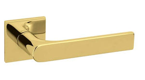 Gold door handle on a white background