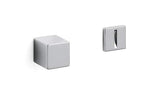 Two metallic square-shaped objects on a white background