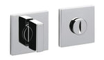 Two chrome door handles on a white background