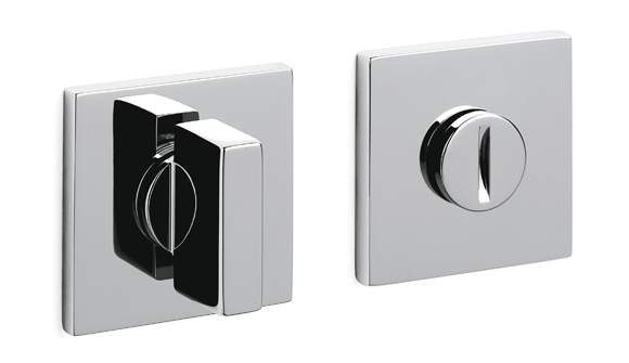 Two chrome door handles on a white background