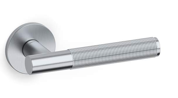 Silver door handle with textured grip on a white background